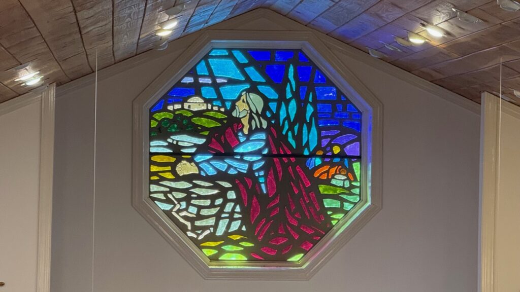 Stained glass window depicting Jesus praying in the Garden of Gethsemane